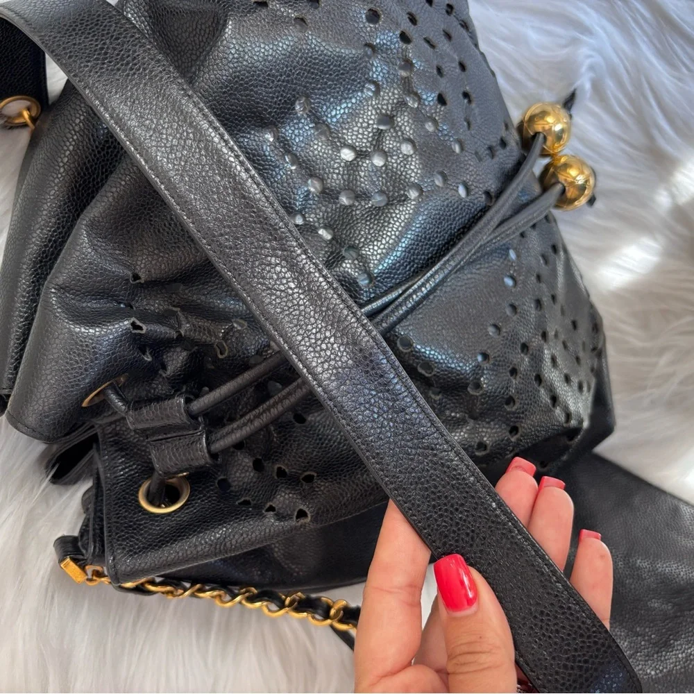 Authentic CHANEL perforated bucket black leather with pouch